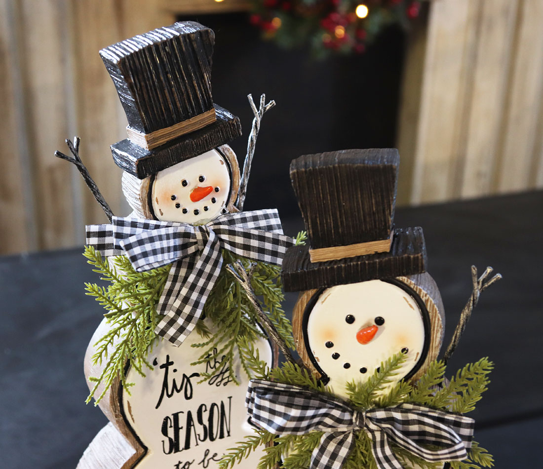 Set of 2 White Resin Snowmen With Pine and Bows